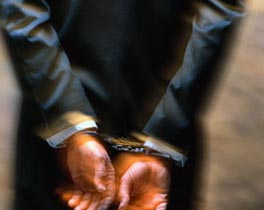 man in cuffs image